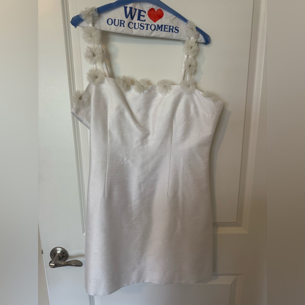 Likely White Dress with Floral Details